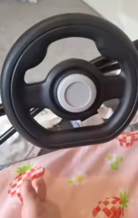 Steering wheel attached near a stroller