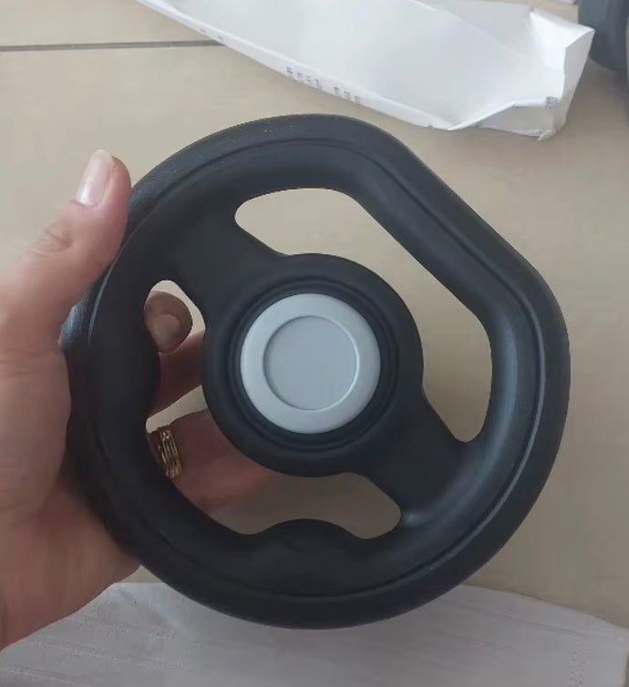 EVAM BABY steering wheel held in one hand